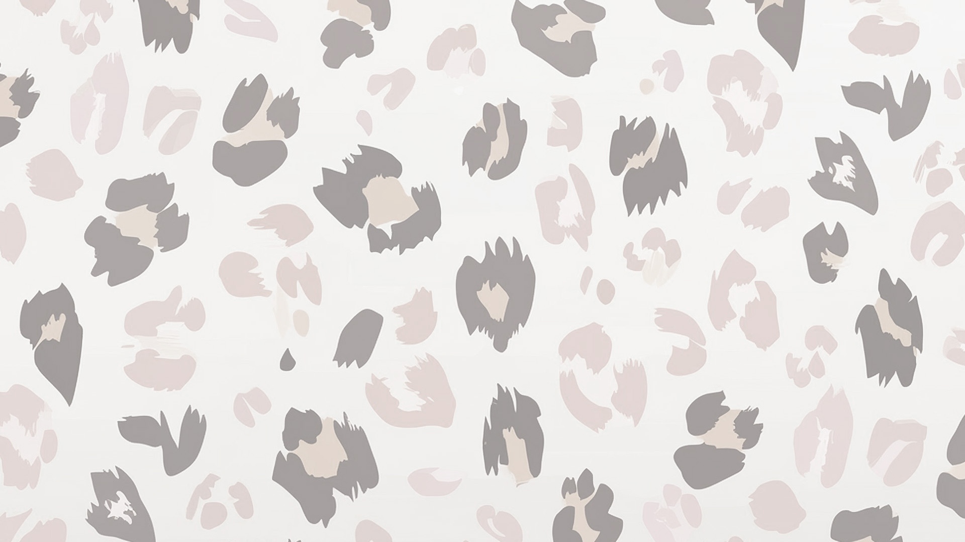 A patterned wallpaper with a floral design and a textured, spotted background.